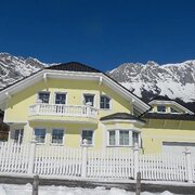 Holiday home against a mountain backdrop